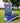 Cornio cornholegame with blue printed UV print outside in the grass summer with cornholebags
